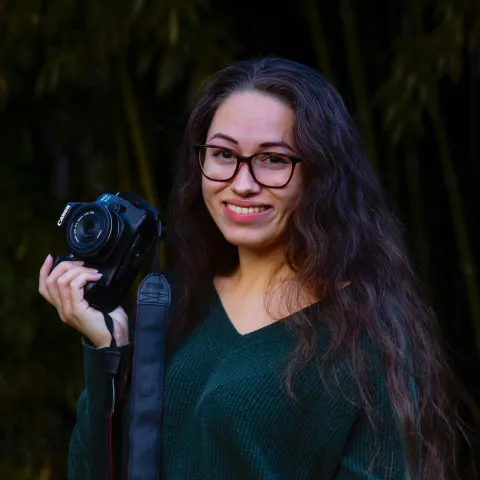 woman holding a camera
