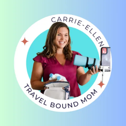 woman holding blue bottle and smiling 