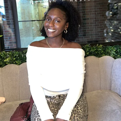 A picture of Asi smiling